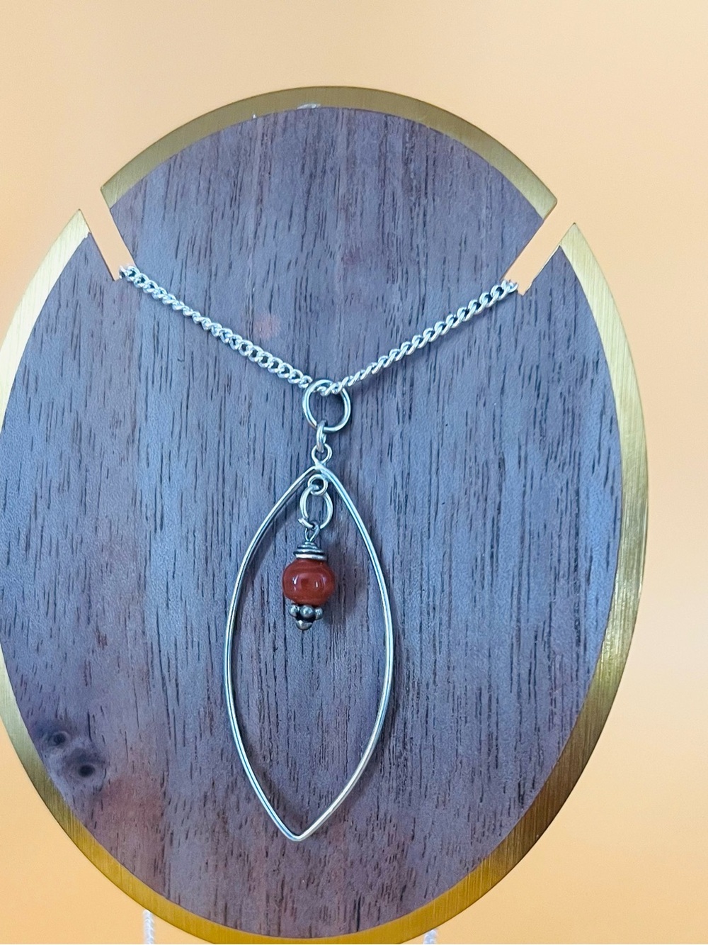 Elegant Silver Pendant Necklace with Brown Accent